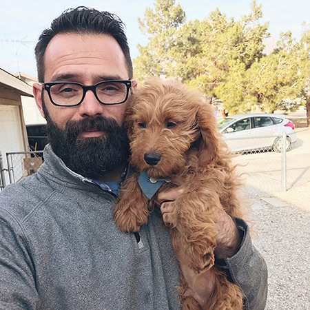 Jason Rae with a puppy
